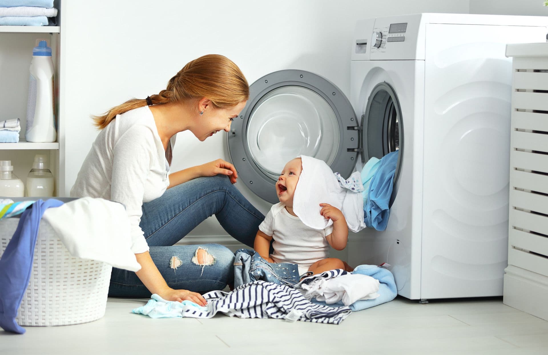 Woman Doing Laundry with Child
