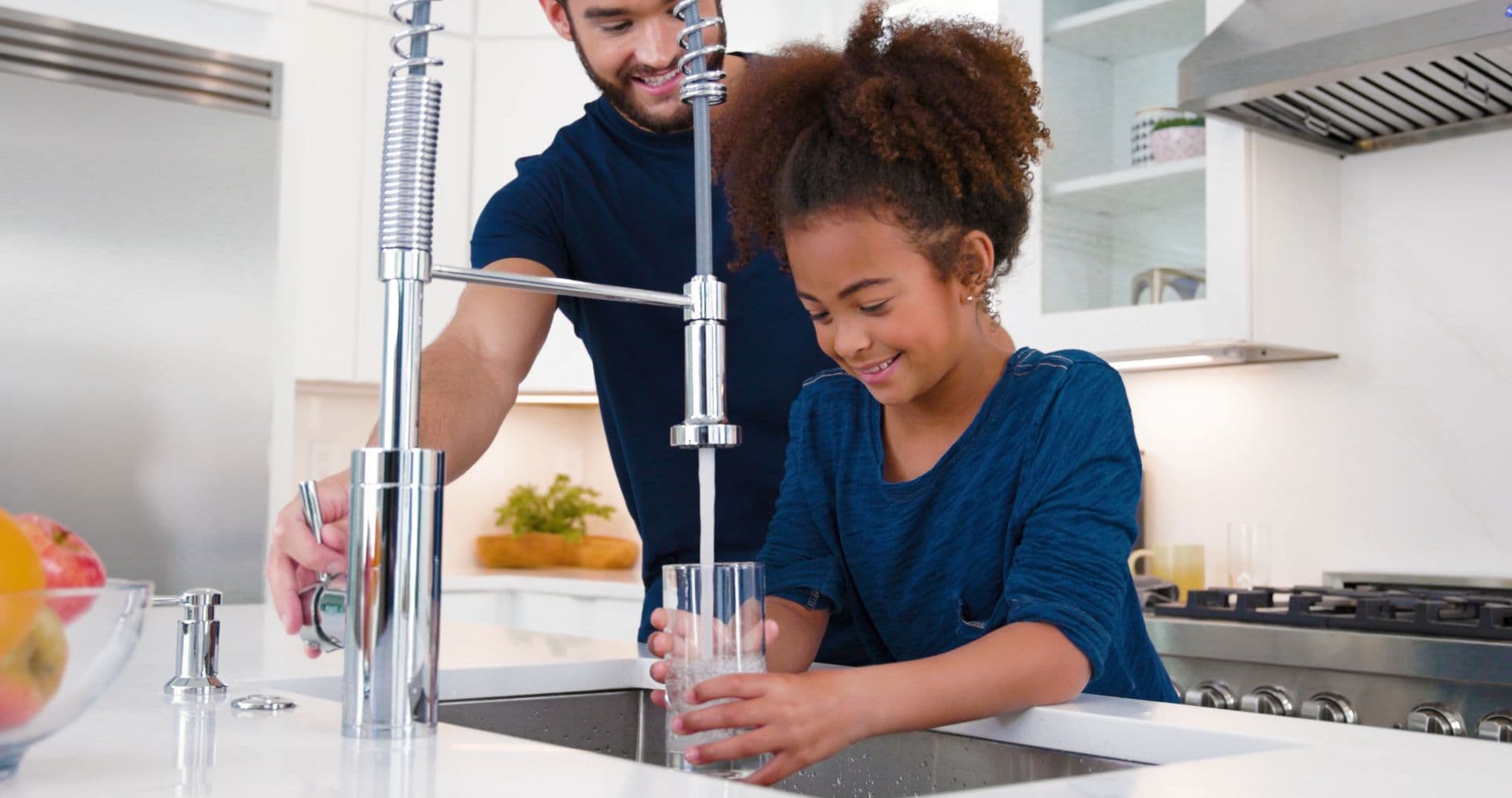 Girl filling up glass